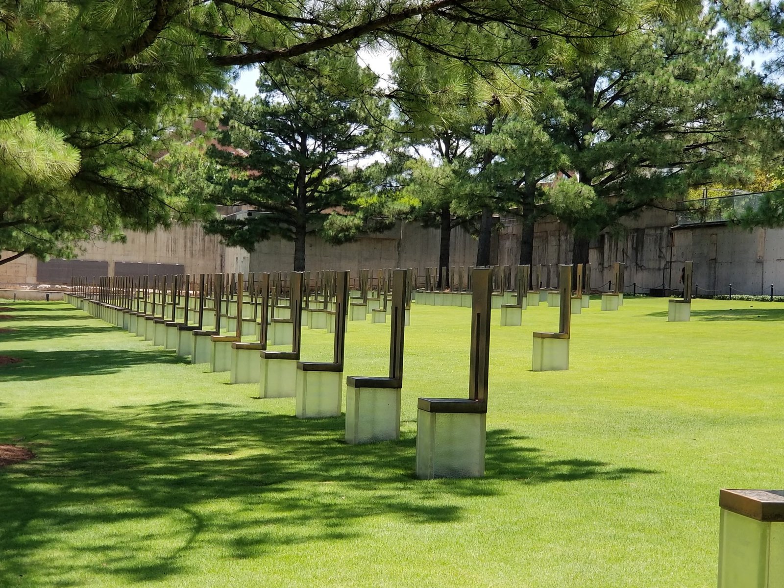 The 168 Chairs represent those killed on April 19, 1995. They stand in nine rows, each representing a floor of the Federal Building where the field is now located. Each chair bears the name of someone killed on that floor. Nineteen smaller chairs stand for the children. ..........................................